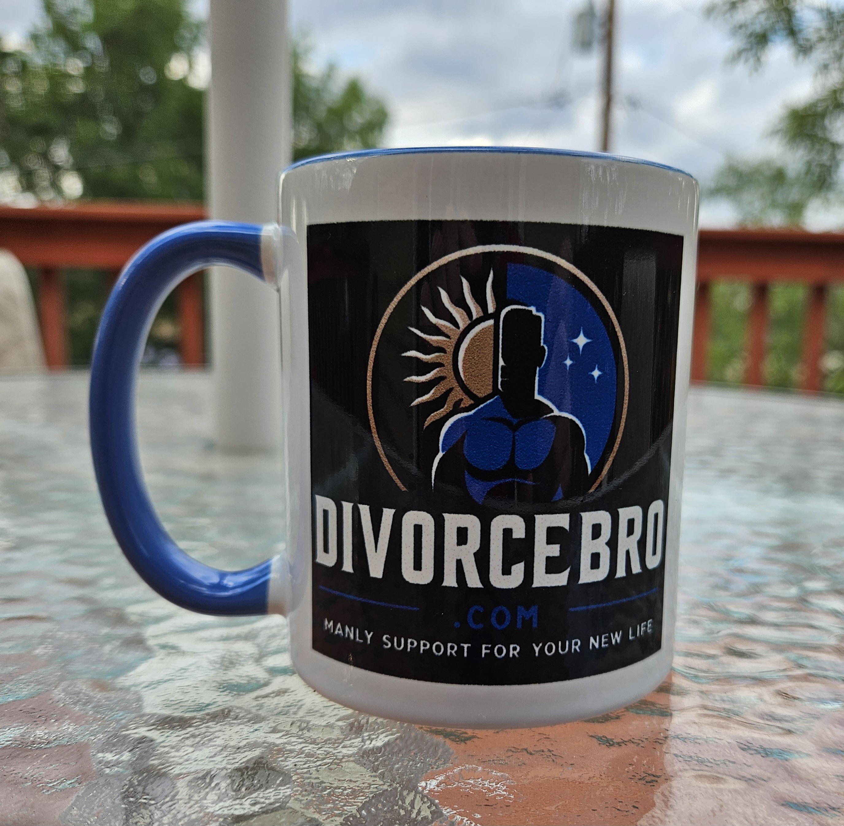 A DivorceBro mug on a patio table