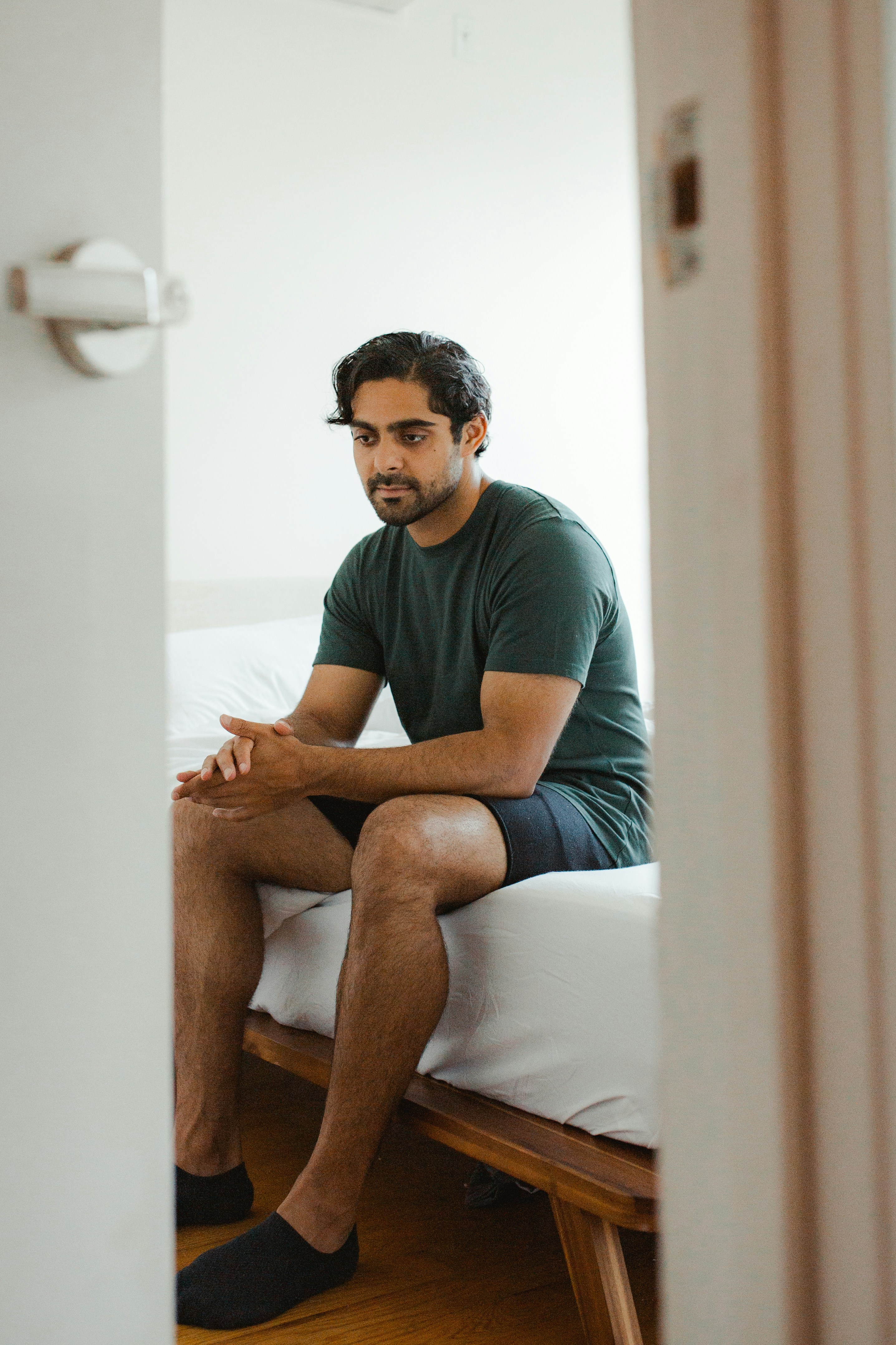 A man sitting alone, lost in thought